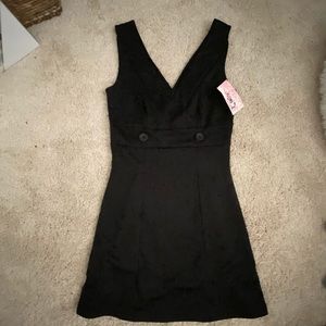 Mini black dress.